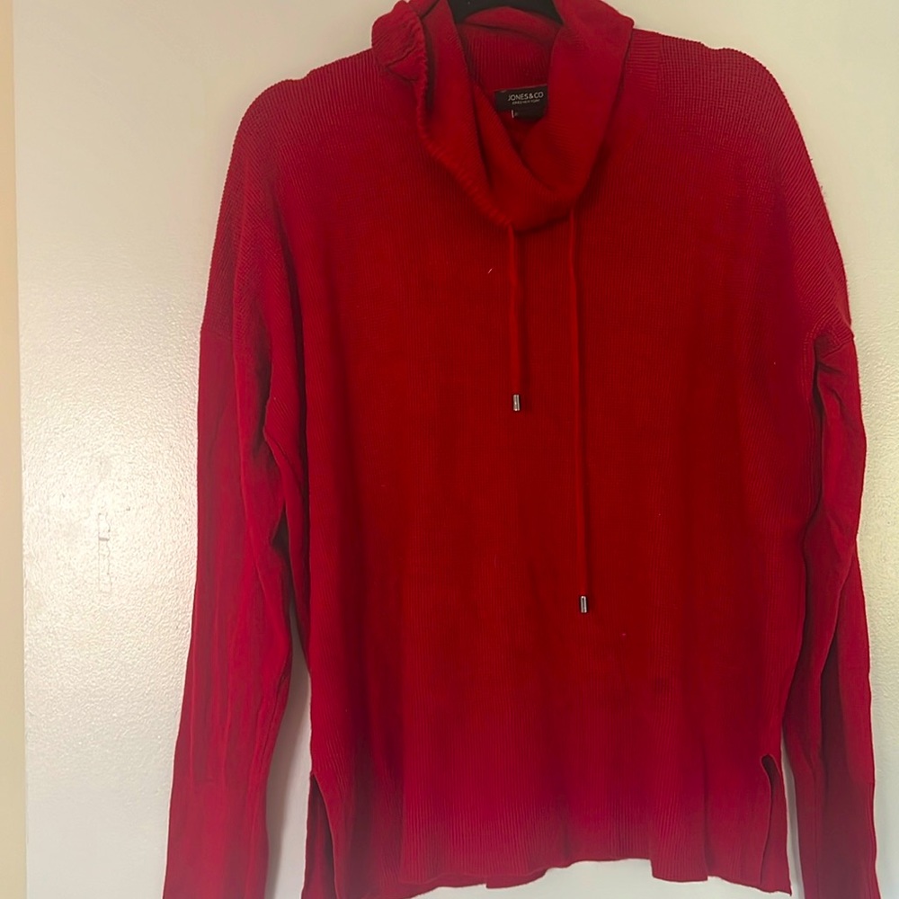 Fair condition red sweater.